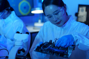 Technician working on analyzing semiconductor or microchip boards, electronics industry, electronic engineer, computer technology, CPU maintenance