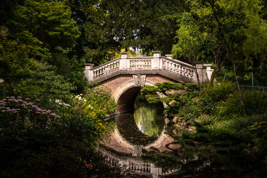 Stone Bridge Reflected in the Pond at Parc Monceau, Paris, France