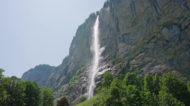 Staubbach Falls Cascading Down Cliff in Lauterbrunnen, Switzerland