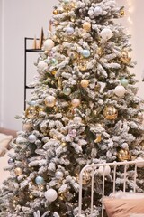 The interior of a room decorated for the new year. Beautiful Christmas tree decorations