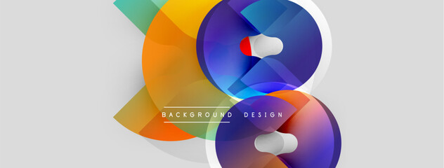 Abstract colorful overlapping circles create dynamic visual. Gradient shades blend, forming modern design element. Light gray background provides contrast.