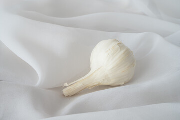 High key still life of Garlic with with background