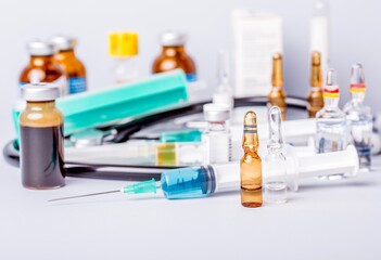 Medical vial with medication and syringe close up