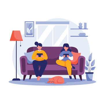 Two women are relaxing on a sofa in a cozy living room, each engrossed in their tablets, while a cat naps peacefully on the floor.