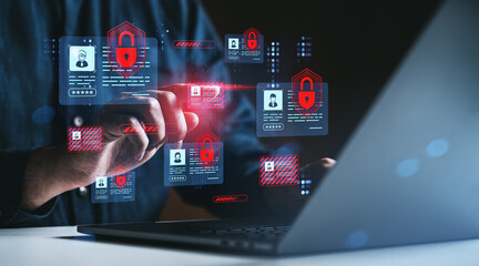 Man interacting with virtual cybersecurity interface showing red padlocks and digital ID cards on...