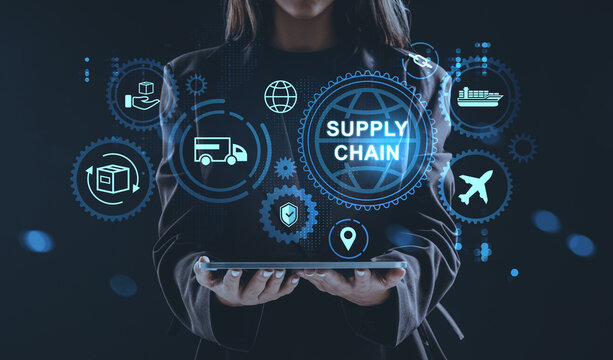 Digital supply chain management concept with logistics holograms and icons above tablet held by businesswoman on futuristic background.