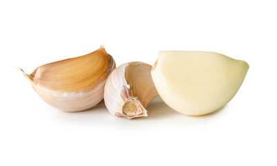 Side view of three garlic cloves in heap isolated on white background with clipping path