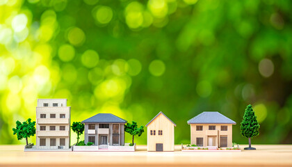 一戸建て模型と不動産の多様な住宅スタイルを描いたナチュラルで温かみある風景