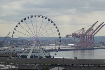 Seattle Great Wheel framed against cloudy waterfront