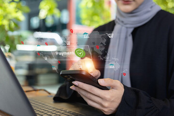 muslim women using smartphone for global online payment with digital map interface and security icon. Concept of fintech, e-commerce, secure transaction, digital banking and mobile technology.