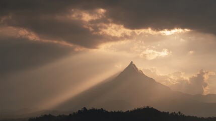 bedrock. Golden light breaking through clouds over a majestic mountain peak. travel magazines, destination branding, designed for outdoor magazines and nature guides and travel destination branding.