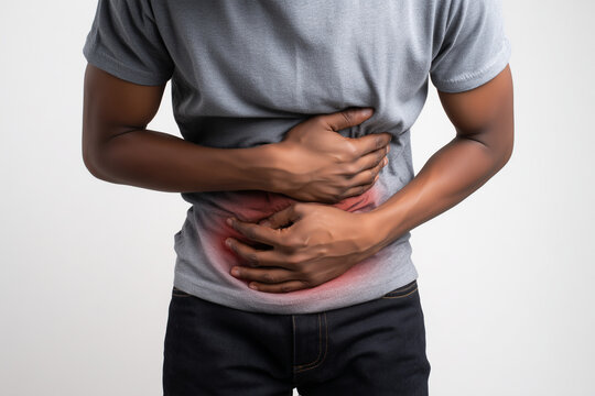 Man experiencing lower abdominal pain, a common symptom of chlamydia infection. Subtle red highlight suggests pelvic inflammation. Ideal for content on STIs and male reproductive health