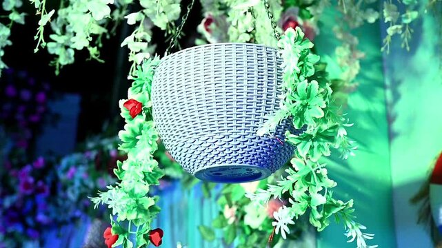 Vibrant garlands in various colors, hang beautifully as traditional Indian wedding decorations, creating a festive floral backdrop for celebration and temple entrance adornment.