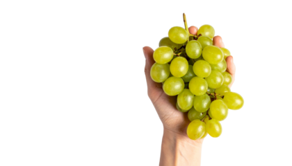 A hand holding a bunch of fresh, green grapes against a bright background. The grapes look juicy and ready to eat, with a focus on freshness and natural produce. 