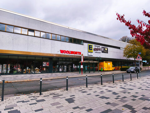 Iserlohn Letmathe Germany October 26 2025 Woolworth and Edeka supermarkets with brand signs and storefronts in city center