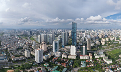 Aerial view of busy highway and parking area with moving traffic in Hanoi.