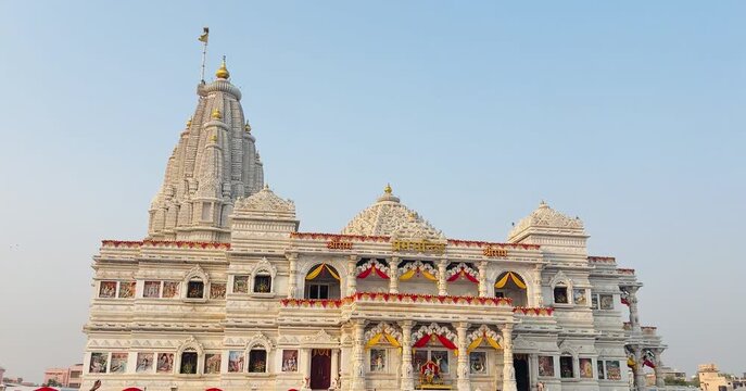 Close-up view of the magnificent spire and ornate carvings of Prem Mandir temple in Vrindavan. The intricate details of marble craftsmanship highlight Indian temple architecture and spiritual artistry