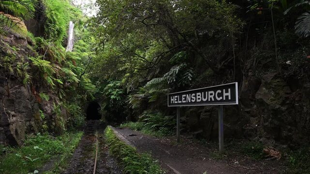 entrance to the old abandoned Helensburgh Railway Station and tunnel near Sydney in Australia, a popular travel destion to see glow worms glowing in the darkness.