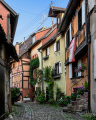 Narrow street in Eguisheim, Alsace, France 