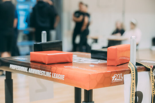 A professional arm wrestling table stands ready in a gymnasium, its pads and grips set up for the next match. 10.25. 2025 Valmiera, Latvia