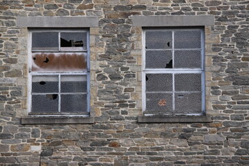 Old Window in Brick Wall
Weathered window framed by aged, cracked, and neglected bricks.
