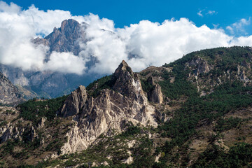Magnificent rocks with no vegetation against the blue sky. Mountain landscape, Caucasus