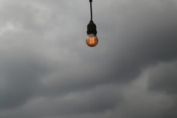 Minimalist Hanging Lamp on Cloudy Background