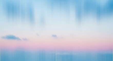 Fototapeta premium Abstract blurred image of a serene sky with soft pastel colors blending blue and pink hues, creating a tranquil and dreamy atmosphere.