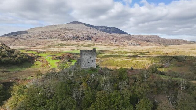 Castell Dolwyddelan and Eryri Mountains from a drone, Snowdonia, Conwy County Borough, Wales, England