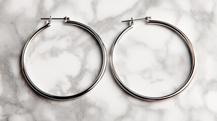Elegant Silver Hoop Earrings on Marble Background, Modern Fashion Jewelry for Stylish Accessories and Chic Outfits