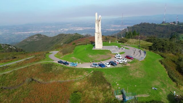 Majestic Cristo del Naranco statue atop Monte Naranco, offering breathtaking panoramic views of Oviedo and the Asturian landscape. A popular tourist destination.