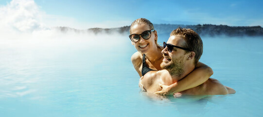Happy couple relaxing in Blue lagoon pool in Iceland. Thermal spa. copy space