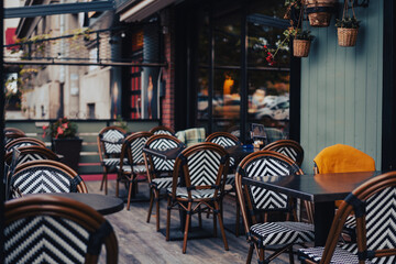 Empty street cafe on an autumn day, beautiful urban European background
