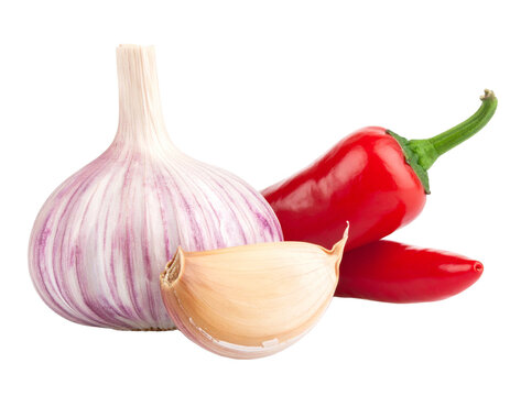 Red chili peppers and garlic isolated on white background, complementary cooking spices, aromatic food ingredients, close-up still life.