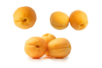 Ripe juicy orange apricots isolated on white background.