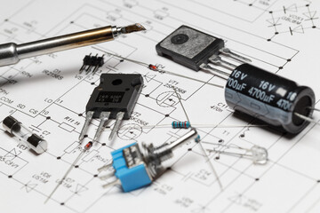 Radio components against the background of a schematic diagram
