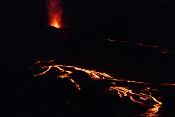 Eruption au Piton de la Fournaise de nuit, seules les coulées de lave sont visibles, île de La...