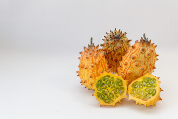 Horned melon sliced open showing green pulp