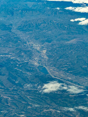 Naklejka premium aerial view of mountain landscape around Curtea de Argeș a city in Romania on the left bank of the river Argeș in a valley of the Southern Carpathian's with lake Zigoneni