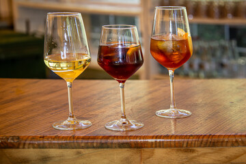Refreshing drinks including wine and cocktails on bar counter