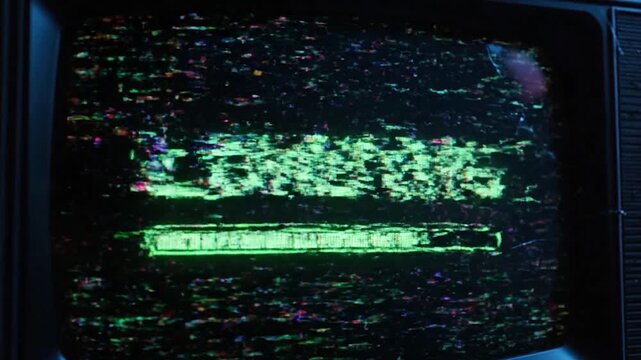An old, damaged TV screen displays the green word "LOADING" and a progress bar