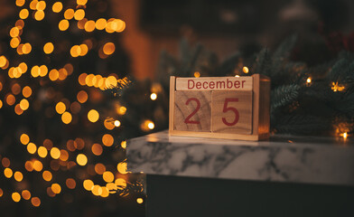 Wooden Block Calendar Displaying December 25 Amidst Warm, Festive Bokeh Lights, Capturing the Essence of the Holiday Season