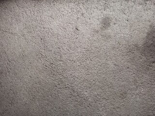 Rough textured gray concrete wall surface background