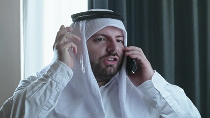 An Arabic man argues with someone by phone, an unpleased prince shouting
