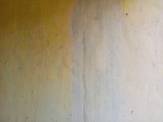 Vertical Color Divide on Aged Yellow Paint Wall