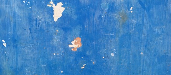 Vibrant blue painted wall with peeling paint and grunge texture