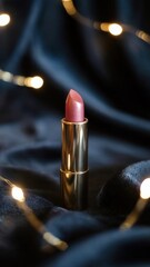 Elegant lipstick on a dark silk background with bokeh lights, creating a glamorous scene