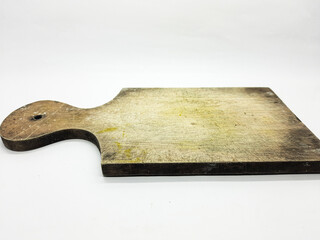 Wooden cutting board sits on a white background showing its aged texture and rustic charm perfect for culinary presentations or showcasing food preparation concepts.