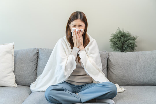 Female unhealthy Sickness, asian young woman, girl unwell and coughing, have cold, sore throat isolated white background suffering with symptom cough feeling bad. Healthcare of Coronavirus, covid-19.