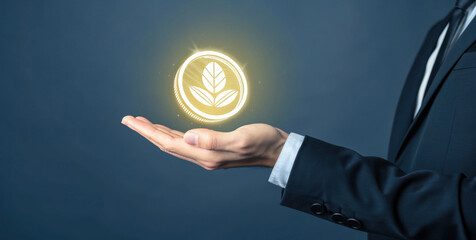 Golden eco coin icon floating above open hand in suit, sustainable finance symbol glowing with leaf emblem, futuristic green investment concept